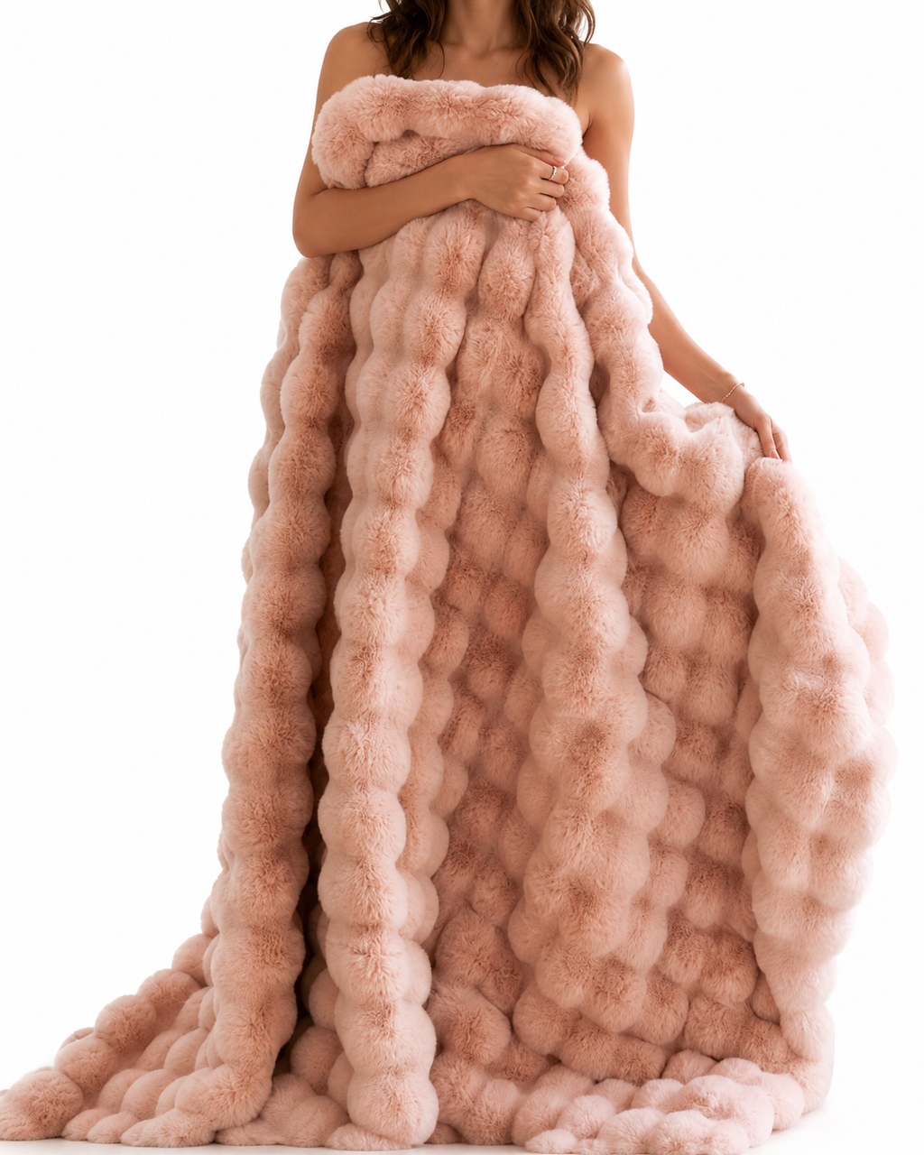 Cherry blossom pink ruched faux fur blanket held by a standing model